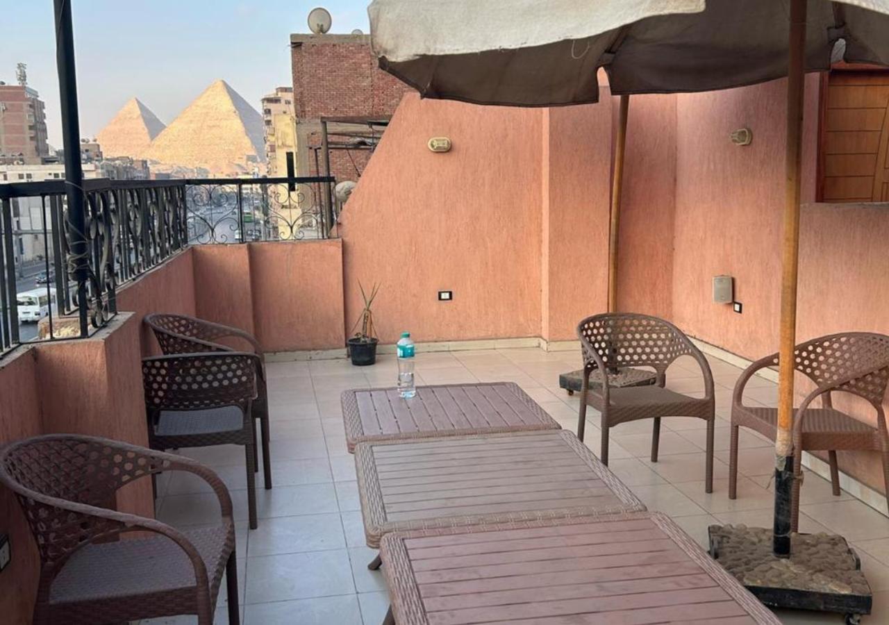 Pyramids Road Guest House Cozy Rooms And Rooftop Breakfast With The Pyramids View Nazlet el-Sisi Bagian luar foto